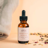 Bottle of Prickly Pear Facial Oil with a dropper on a beige background